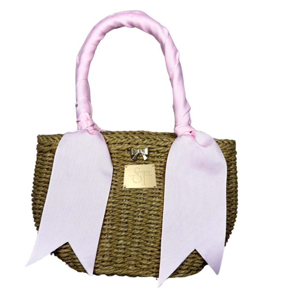 Hand woven rattan handbag with baby pink wrapped handles